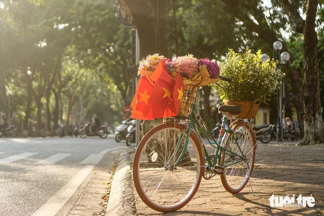 Vintage bike tour during autumn in Hanoi with golden light