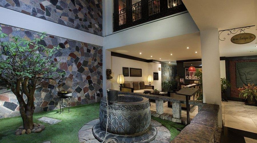 Beautiful interior courtyard of a boutique hotel in Hanoi Old Quarter with traditional Vietnamese elements