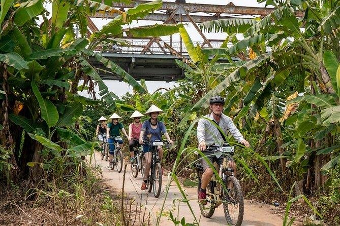 E-bike tourists resting and taking photos in Hanoi