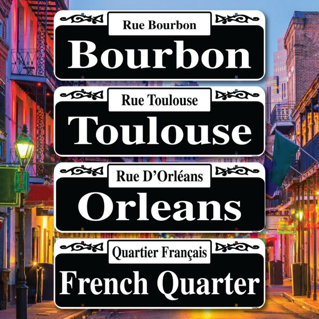 Street signs in French Quarter showing bilingual names