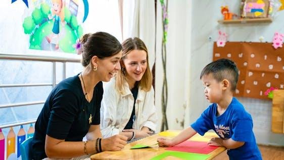 International students volunteering with local students in Hanoi