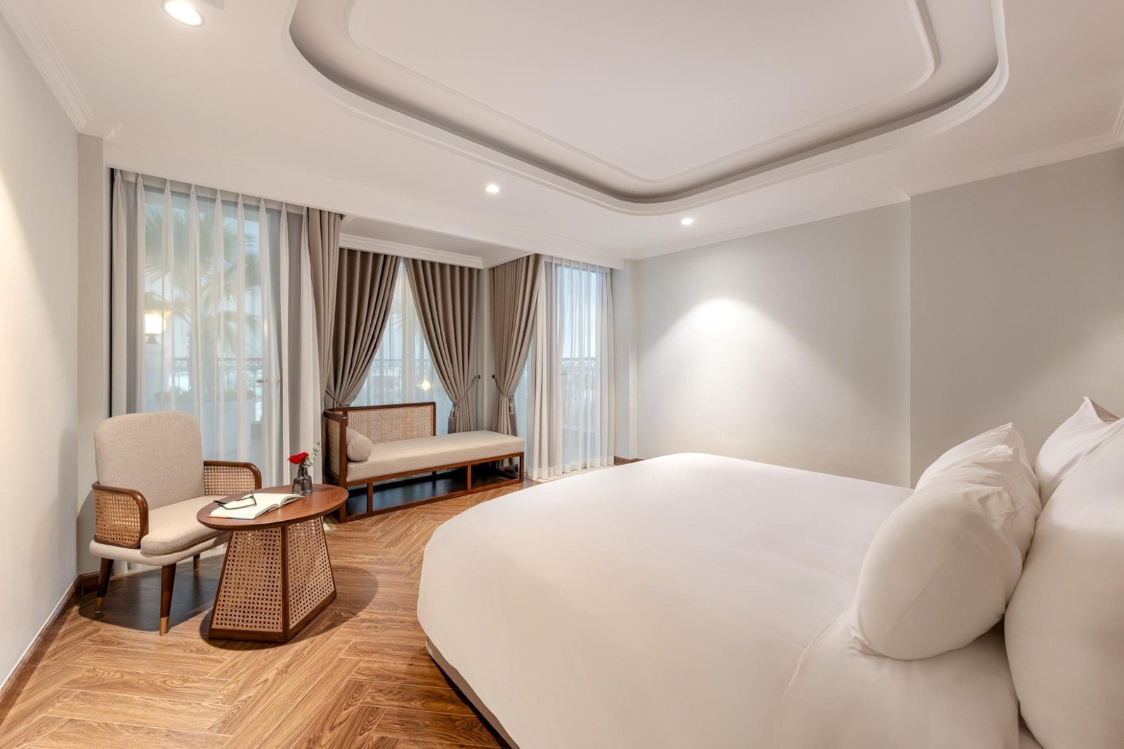 Elegant hotel room at La Siesta Hotel in Hanoi Old Quarter with traditional Vietnamese decor elements