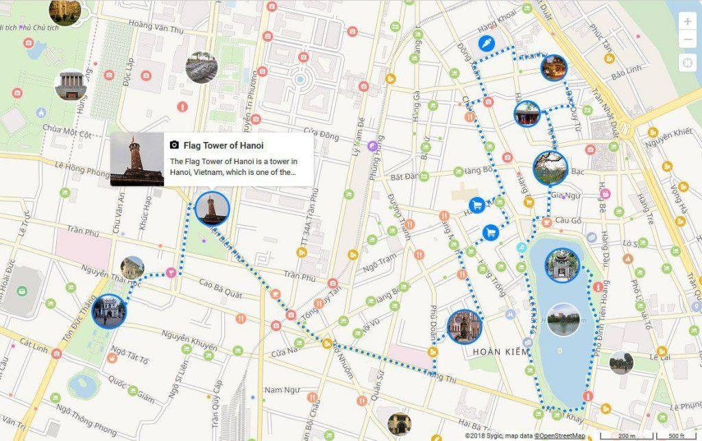 Tourist preparing for walking tour in Hanoi with map and camera