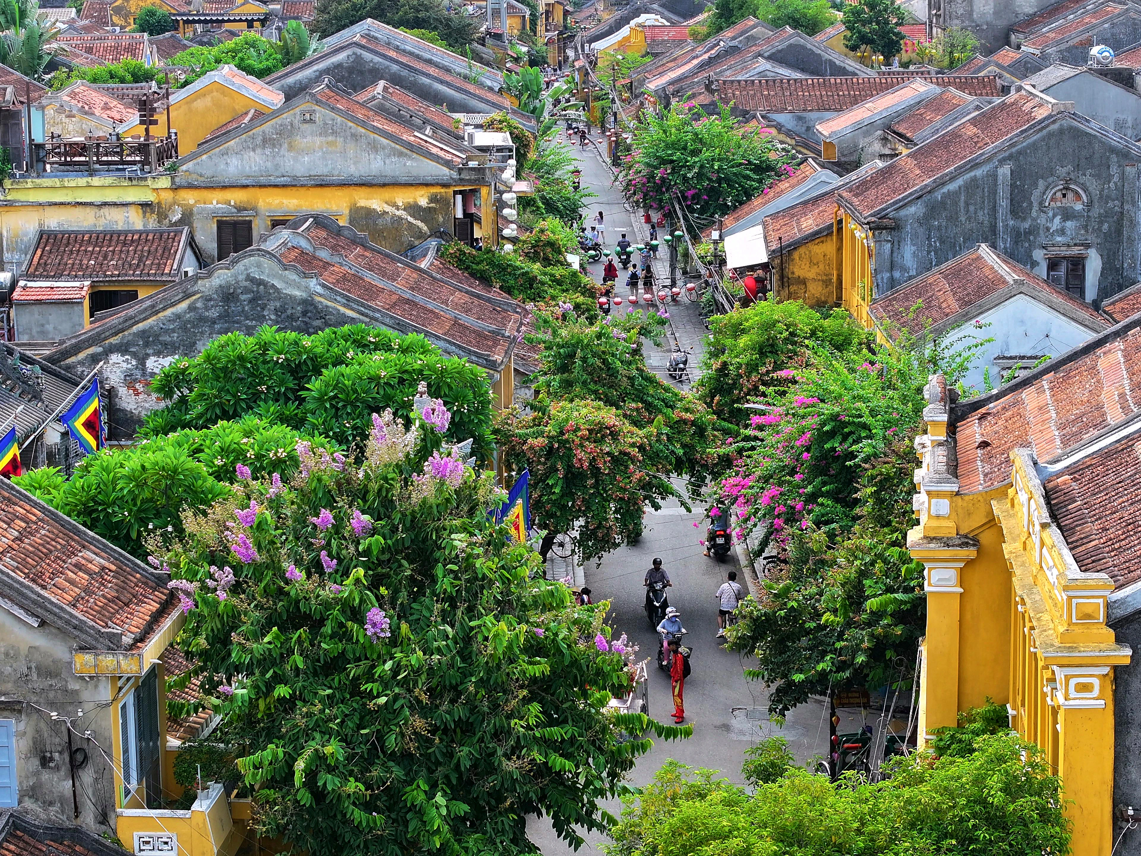 Colorful silk lanterns glowing above the ancient streets of Hoi An, Vietnam