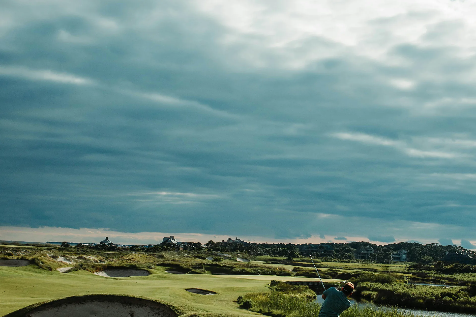 Manicured golf fairway and open sky for a polished Vietnam golf holiday