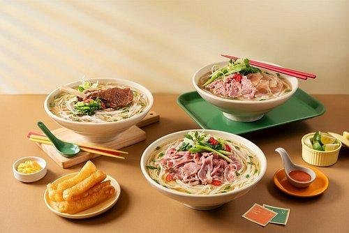 Steaming bowl of authentic pho at traditional Hanoi restaurant
