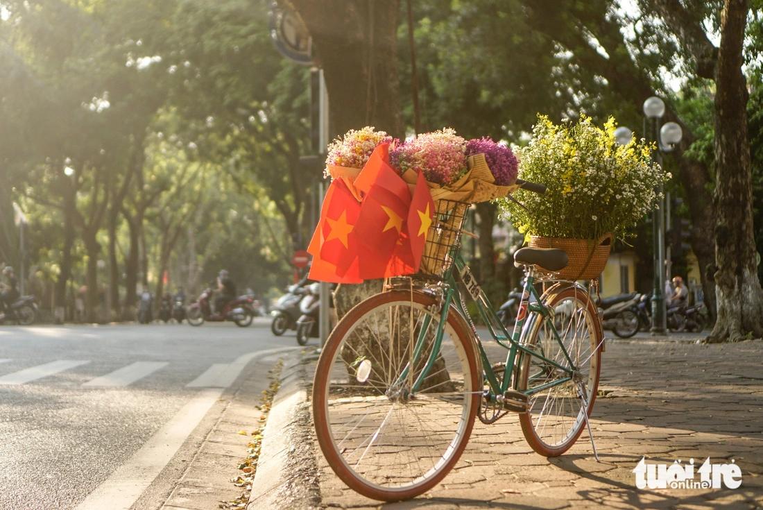 Vintage bike tour during autumn in Hanoi with golden light