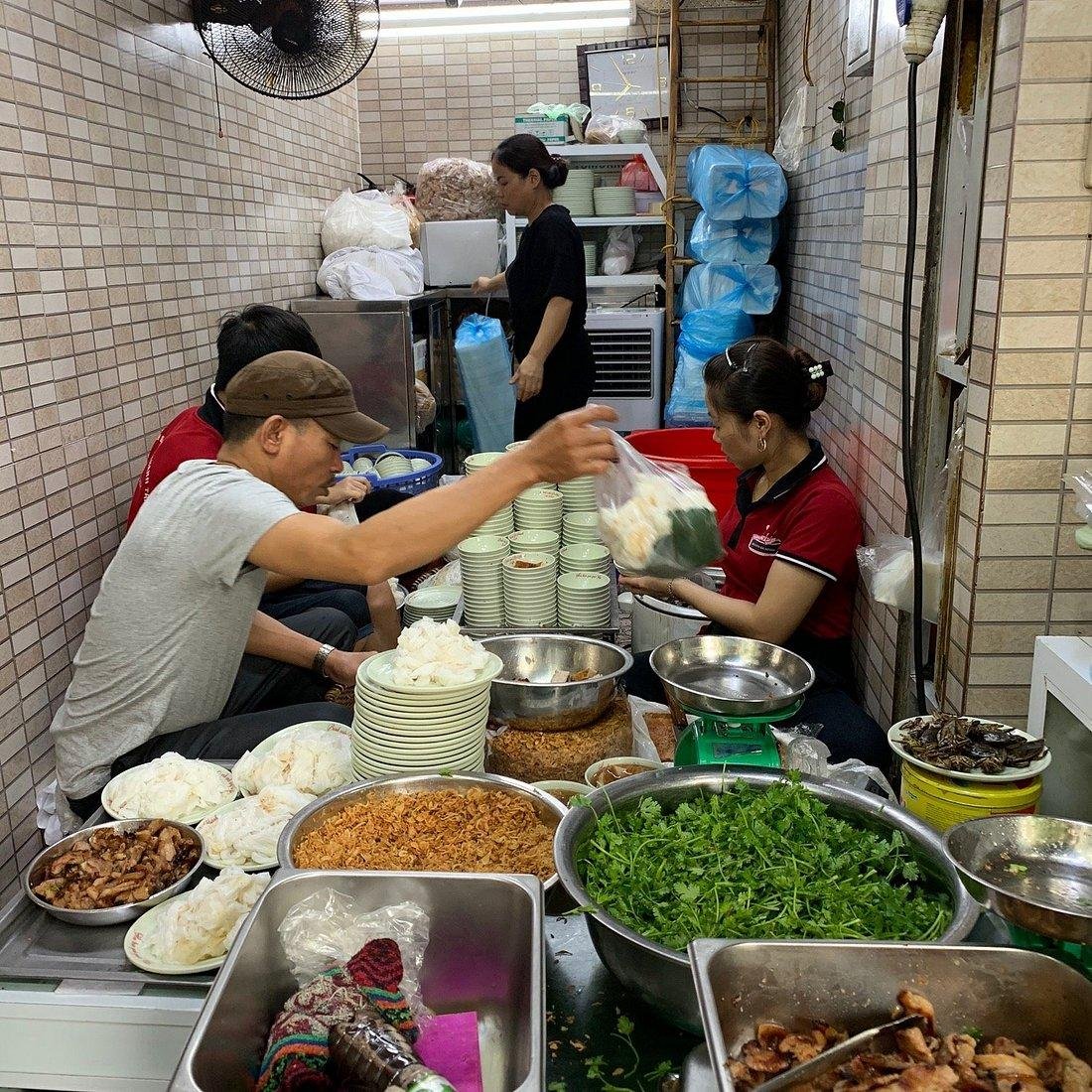 Traditional banh cuon being prepared at street stall