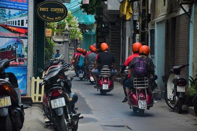 Tourist booking a vegan Vespa food tour in Hanoi