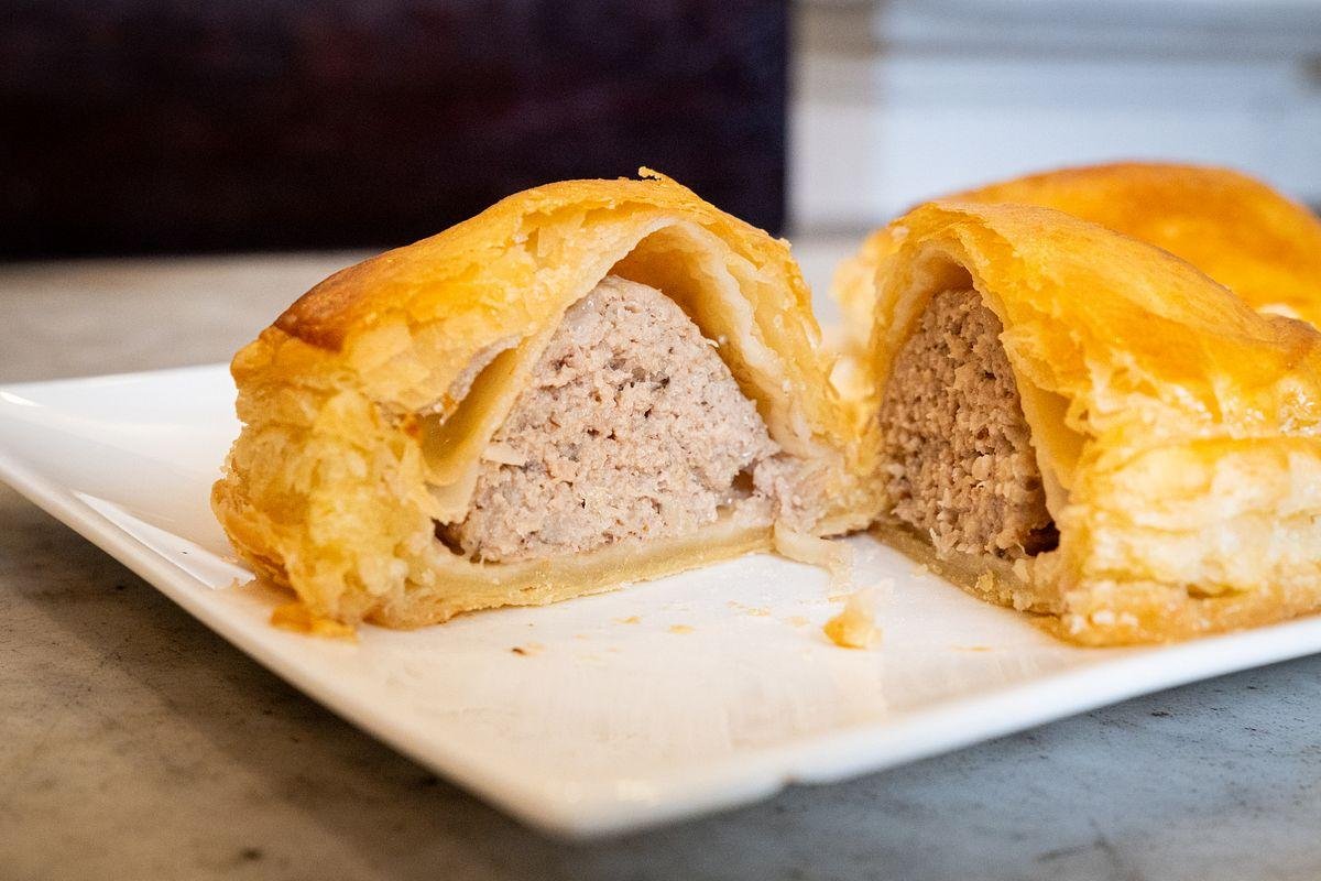 Traditional pâté chaud pastries at Brodard Bakery with golden flaky crust