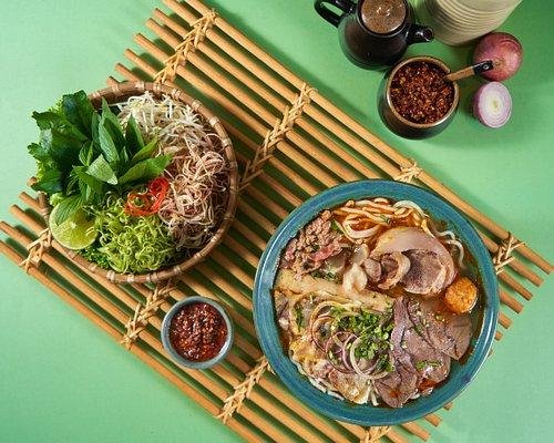 Colorful bowl of Bun Bo Nam Bo with fresh herbs and beef