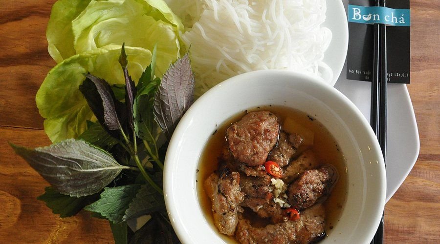 Traditional bun cha with grilled pork, noodles, and herbs