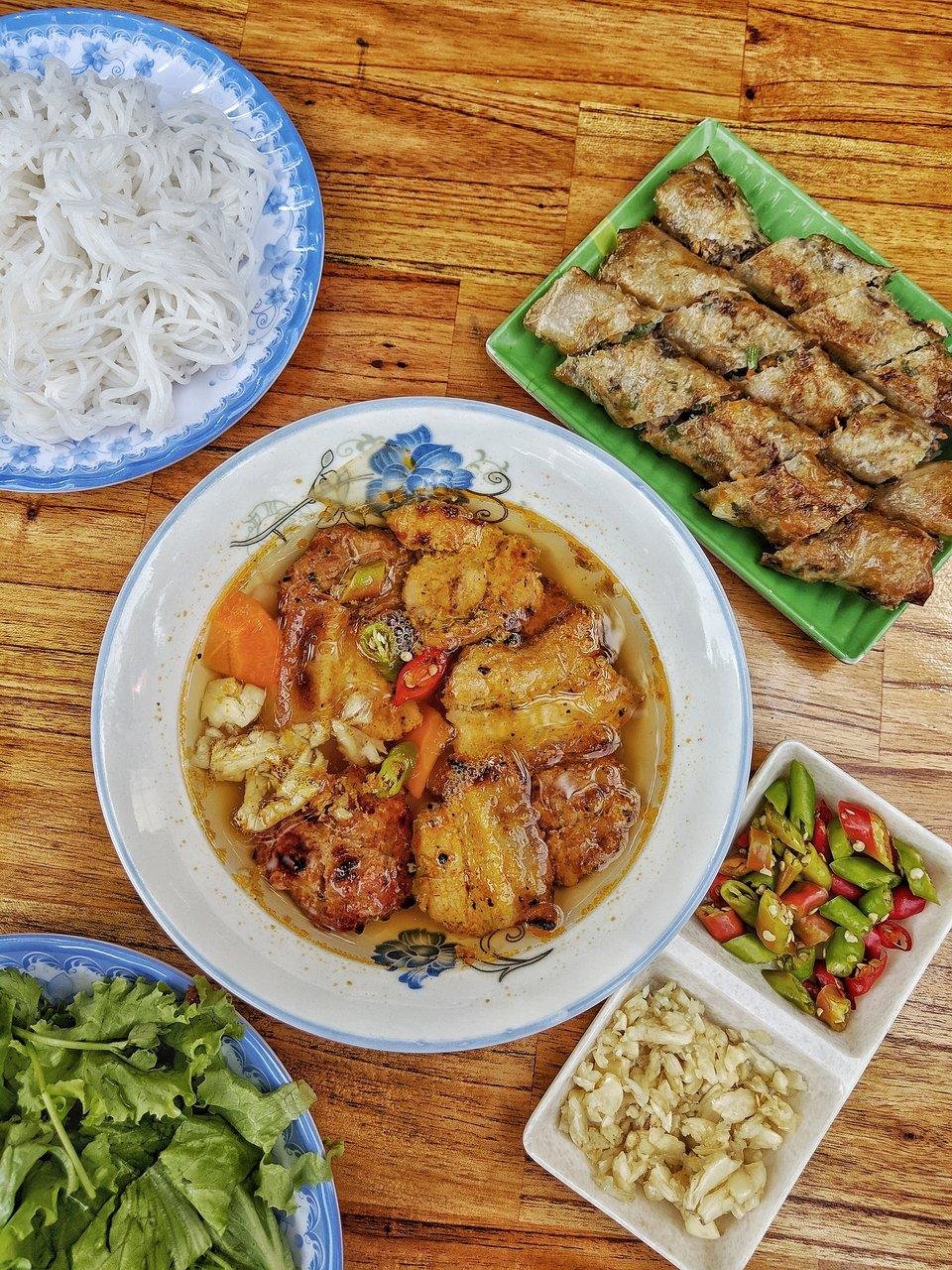 Traditional Bun Cha with rice noodles, grilled pork, and dipping sauce