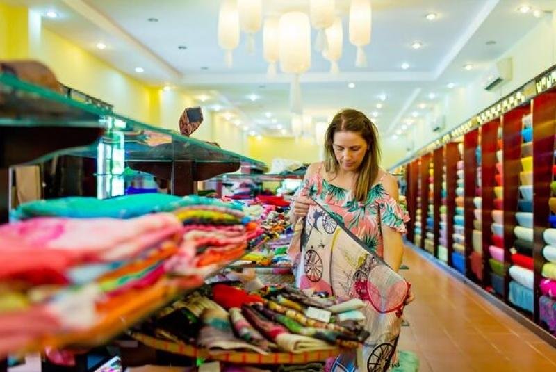 Colorful clothing displays in Hanoi Old Quarter fashion shop