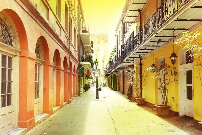 Beautiful sunset over French Quarter buildings with golden light on colonial architecture