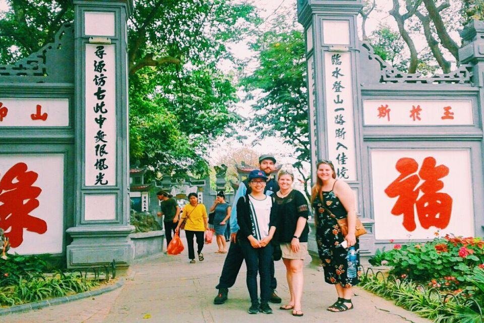 Tourist group enjoying French Quarter tour in Hanoi