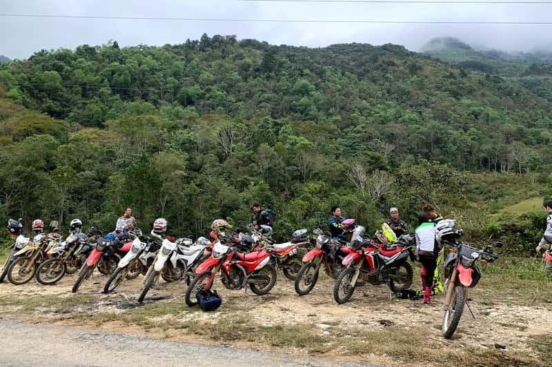Guided dirt bike tour group in Northern Vietnam