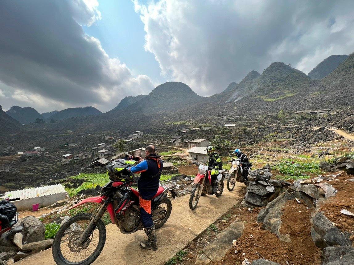 Dirt bike rider on Ma Pi Leng Pass in Ha Giang
