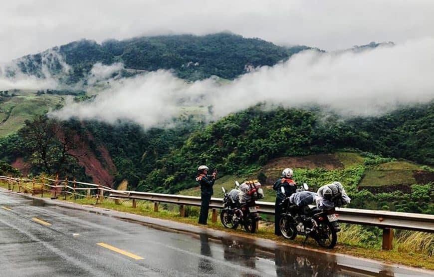 Motorcyclist riding through the scenic Hai Van Pass between Hue and Hoi An