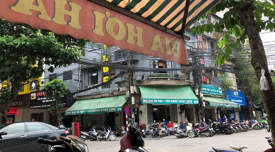 Locals enjoying bia hoi at street corner in Hanoi Old Quarter