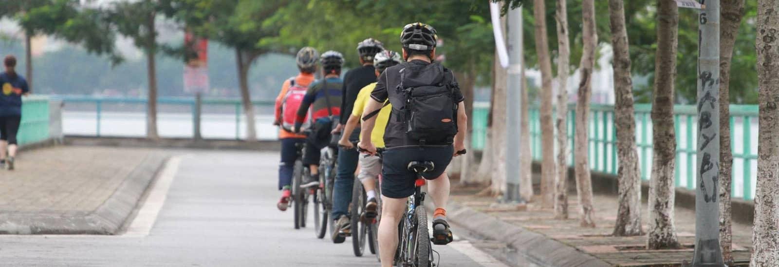 Professional guide leading a bicycle tour in Hanoi