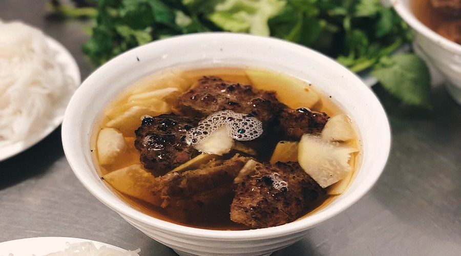 Traditional bun cha served at Hanoi street vendor