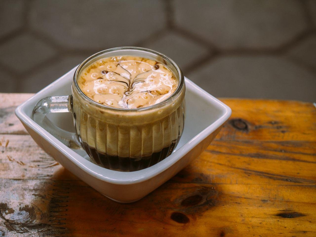 Traditional Vietnamese egg coffee served in a small cup with rich creamy top