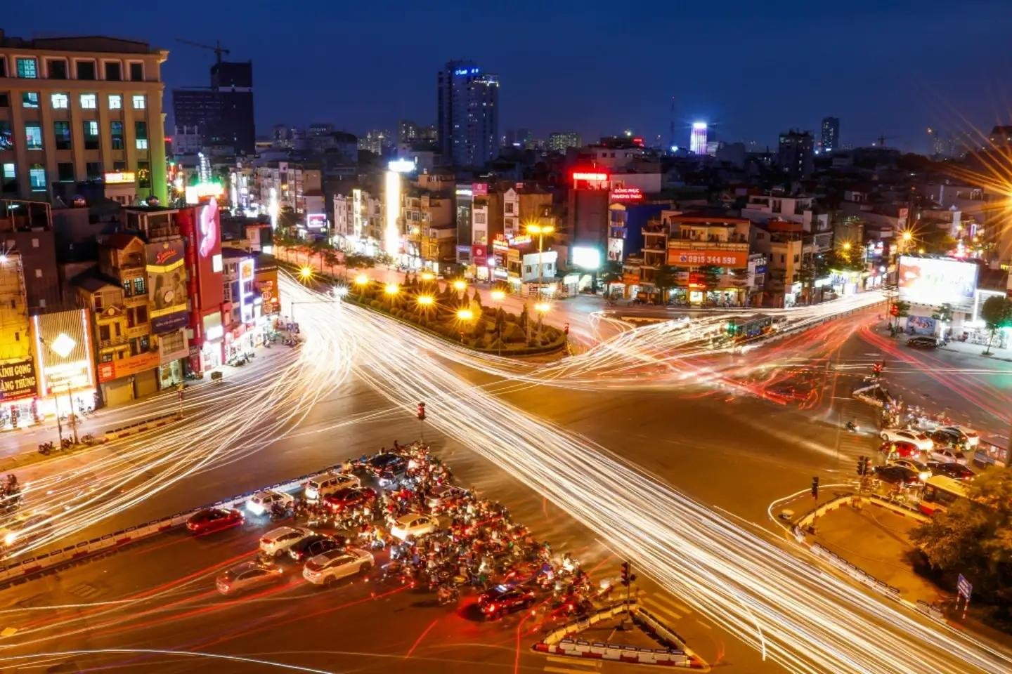 Evening atmosphere in Hanoi with lights and street activity