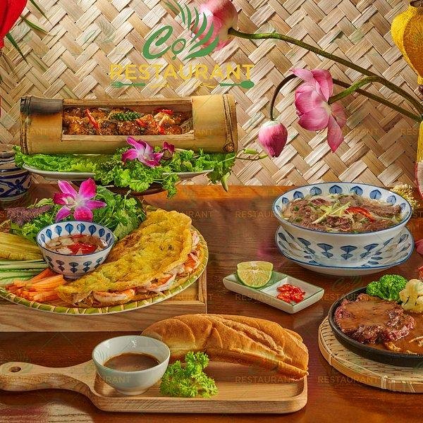 Traditional Vietnamese cooking techniques in modern Hanoi restaurant kitchen