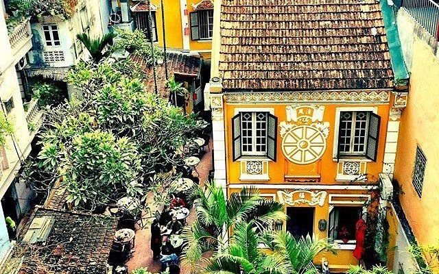 Elegant restaurant facade in Hanoi French Quarter with outdoor seating