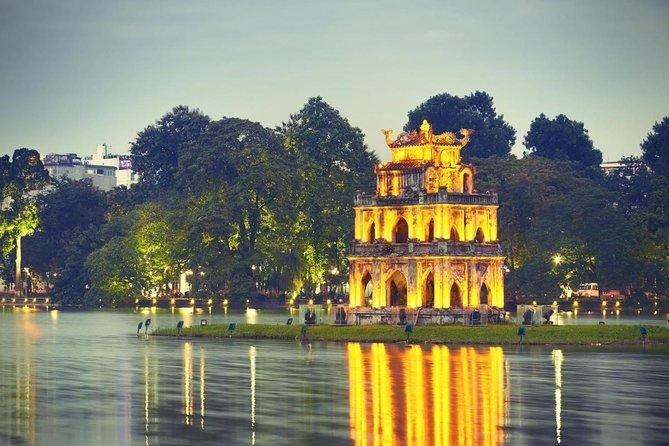 Students gathering for a free walking tour near Hoan Kiem Lake in Hanoi