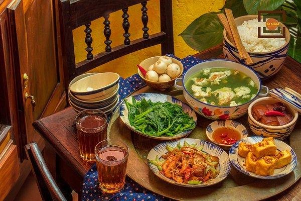 Group of friends enjoying a steaming hot pot meal in Hanoi Old Quarter
