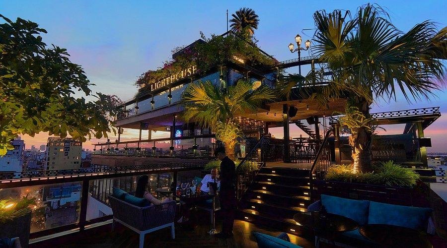 Colorful signature cocktails at The Lighthouse Sky Bar with Hoan Kiem Lake view