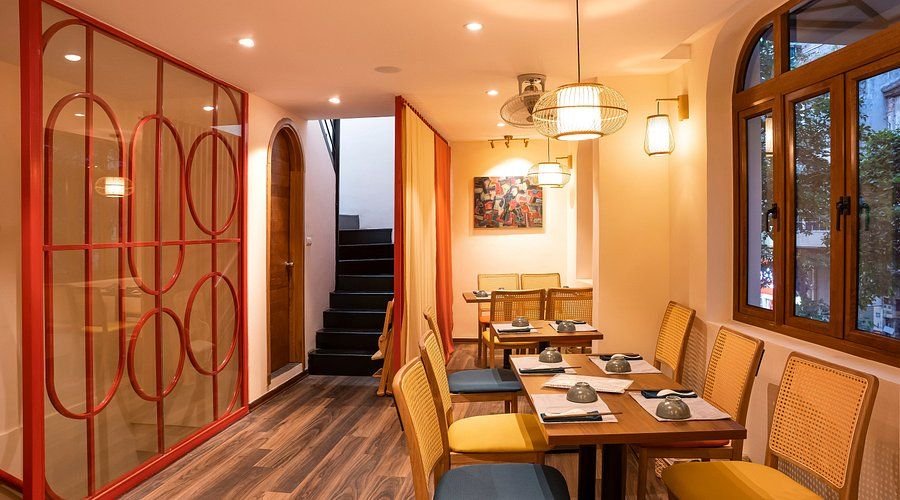 Modern Vietnamese restaurant interior in Hanoi with traditional decor
