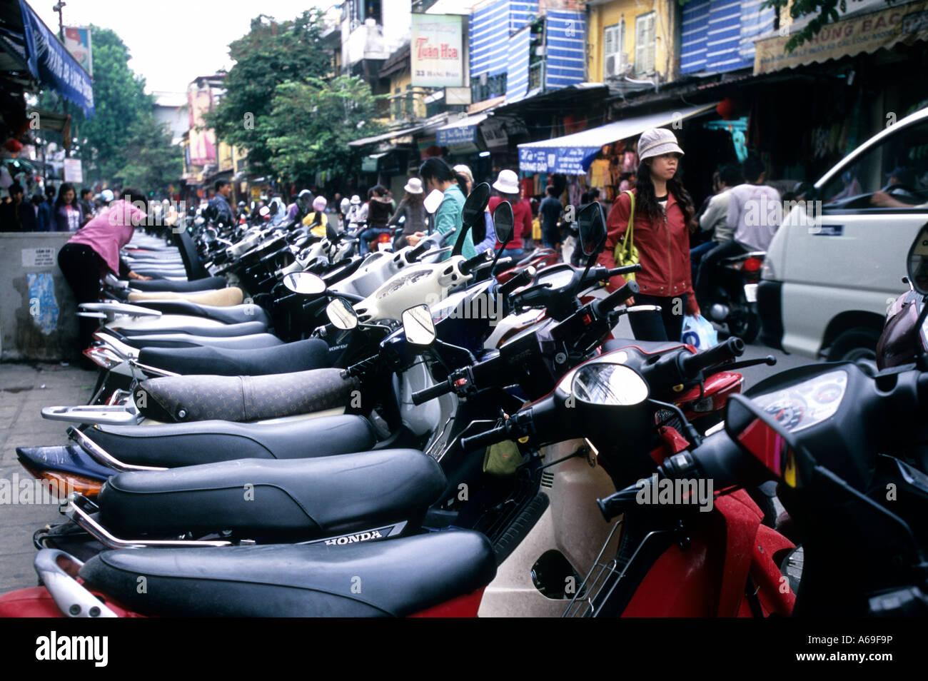 Motorbikes parked on a busy Hanoi street