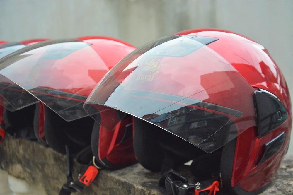 Safety helmets provided for motorbike food tour in Hanoi