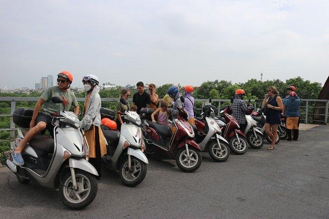 Tourist wearing helmet on motorbike food tour in Hanoi