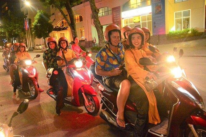 Couple on Vespa during romantic Hanoi night tour