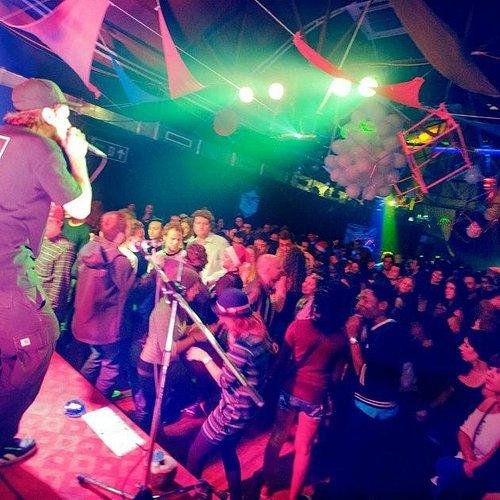 Energetic nightclub in Hanoi with colorful lights and dancing crowd
