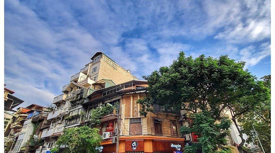 Bustling coffee street in Hanoi Old Quarter with traditional cafes