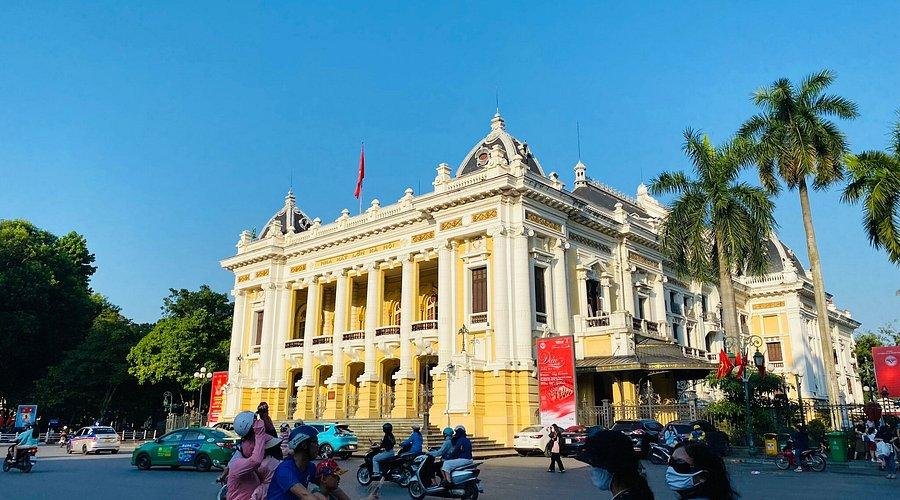 French colonial architecture with characteristic yellow facades and shuttered windows in Hanoi Old Quarter