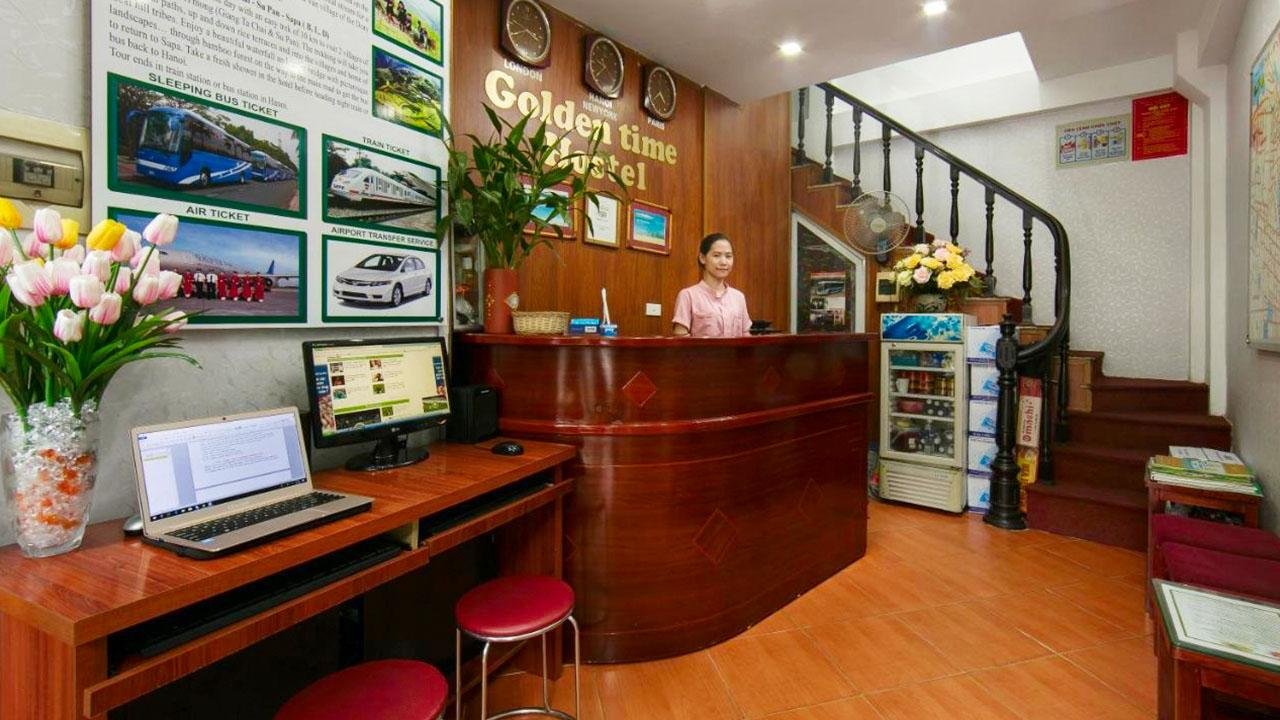 Welcoming reception area of a hotel in Hanoi Old Quarter with traditional Vietnamese decor and friendly staff