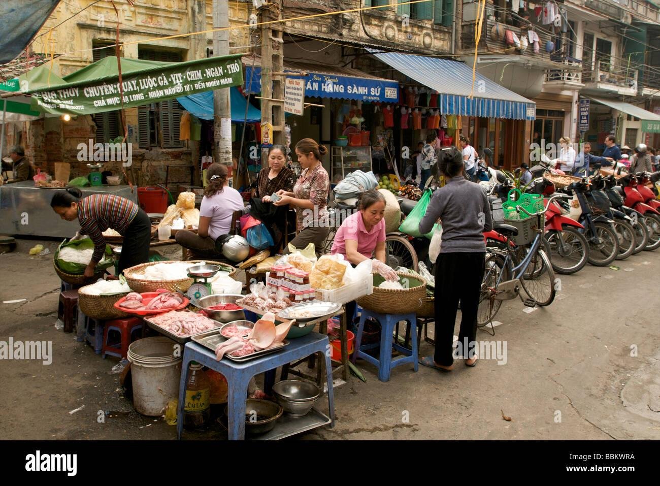 Busy street food scene in Hanoi Old Quarter
