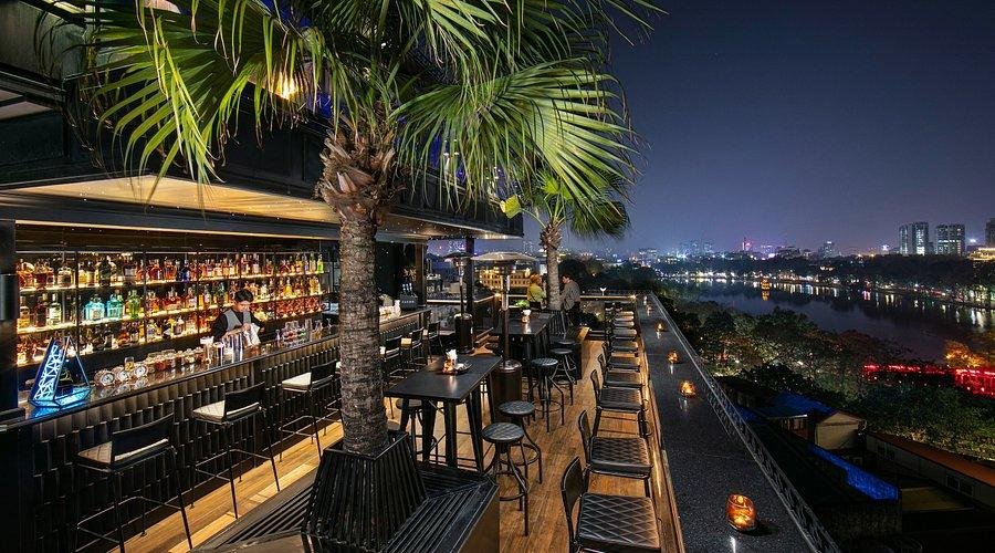Panoramic sunset view from a rooftop bar in Hanoi Old Quarter