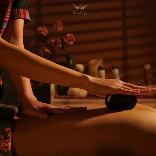 Professional massage therapist performing traditional Vietnamese massage technique