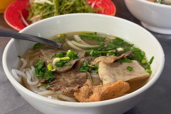 Delicious bowl of pho being served during bike food tour