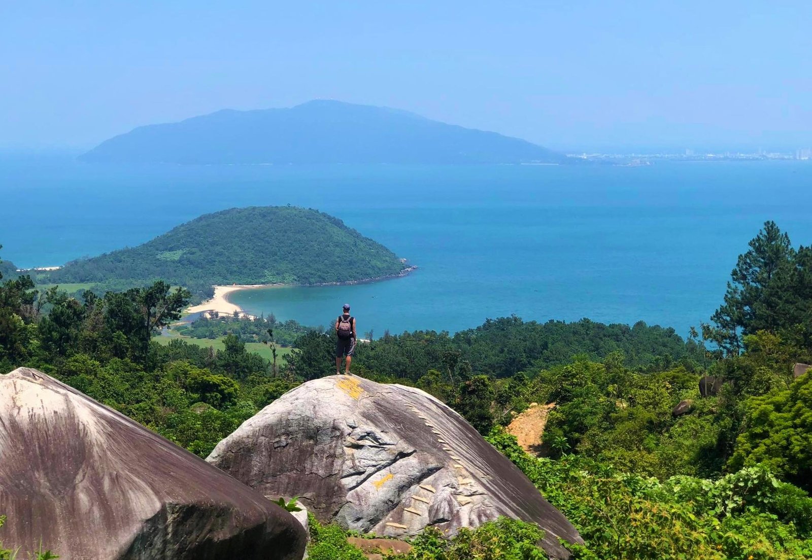 Rider at the top of Hai Van Pass with panoramic ocean view