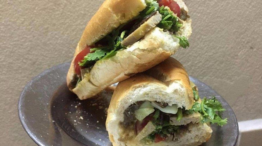 Colorful vegan banh mi with fresh vegetables and herbs