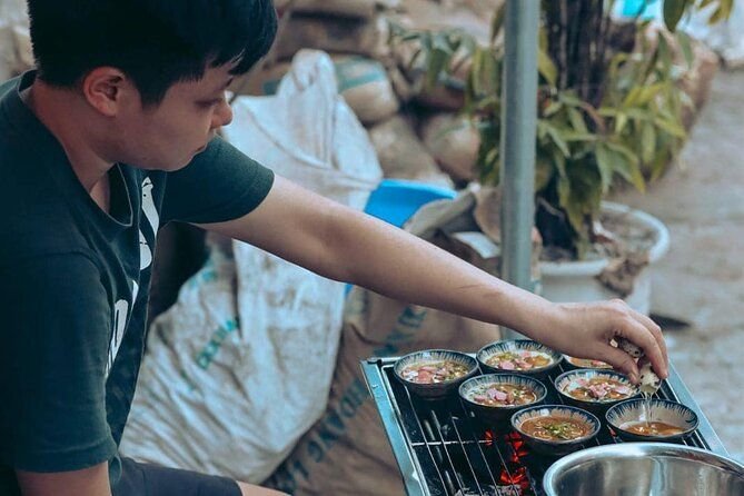 Tour group enjoying vegan food tasting in Hanoi's Old Quarter