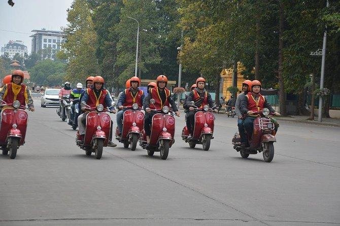 Vespa tour taking safe back street route in Hanoi